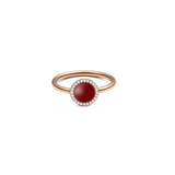 Rose gold ring with round red agate centre and halo of white cubic zirconia, elegant minimalist jewellery design.