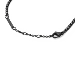 Detail of the Black Crystal Tennis Bracelet showing the adjustable sizing rings, lobster clasp, and individually set black Preciosa crystals in a black stainless steel setting.