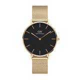 Gold mesh strap women’s watch with black minimalist dial and gold hour markers, Daniel Wellington Petite Evergold.