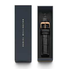 Reading Strap Rose Gold presented in a signature Daniel Wellington box, featuring a black croc-embossed leather watch strap with a polished rose gold buckle and engraved branding.