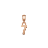 Rose gold number 7 charm with a sleek, polished finish and minimalist design, featuring an adjustable clasp for effortless styling on bracelets or necklaces.