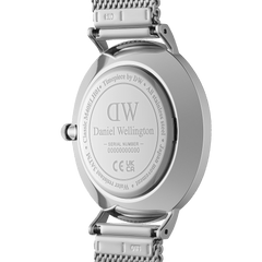 Caseback of the Classic Multi-Eye Sterling Arctic watch showing engraved Daniel Wellington branding, model details, and stainless steel mesh strap.