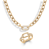 Gold chain necklace and matching ring set, both featuring bold links and a central pavé crystal-embellished link for a modern, elegant finish. The polished gold tone and sparkling crystal accents create a cohesive, sophisticated jewellery look.