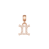 Gemini zodiac charm in rose gold stainless steel, finished with sparkling cubic zirconia crystals in a delicate, modern style.