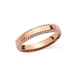 Rose gold ring with a polished finish, featuring two rows of white cubic zirconia crystals along the edges and the Daniel Wellington signature engraved on the band. The design combines classic elegance with a modern touch, making it a versatile accessory for women.