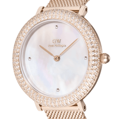 Close-up of the Crystalline Bezel Melrose watch, highlighting the iridescent mother of pearl dial, rose gold case, and bezel encrusted with sparkling cubic zirconia and Preciosa stones.