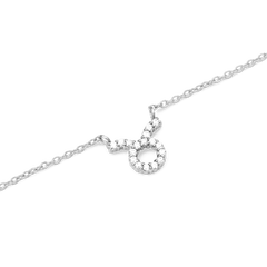 Delicate silver chain necklace featuring a Taurus zodiac pendant adorned with sparkling hand-set crystals.