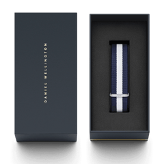 Daniel Wellington Glasgow Strap Silver with navy and white stripes, presented in an elegant branded gift box with a silver buckle detail.