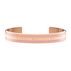 Wide rose gold cuff bracelet with a dusty rose enamel inlay and Daniel Wellington logo engraved at the centre.