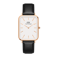 Rectangular Daniel Wellington Quadro Pressed Sheffield watch with an eggshell white dial, rose gold case, minimalist hour markers, and a classic black leather strap.