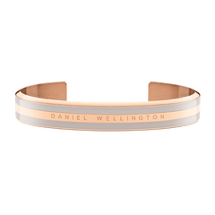 Rose gold Daniel Wellington Emalie Bracelet with Desert Sand enamel detailing, featuring an open cuff design and engraved branding.