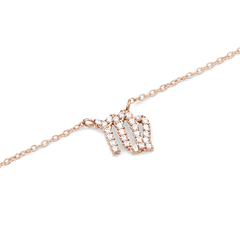 Rose gold chain necklace with a Virgo zodiac pendant, detailed with sparkling hand-set crystals.