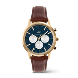 Men’s chronograph watch featuring a blue enamel-finished dial with white sub-dials, gold PVD-plated stainless steel case, and a brown genuine leather strap with pin buckle.