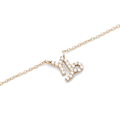 Delicate gold chain necklace featuring a Capricorn zodiac pendant adorned with sparkling hand-set crystals.