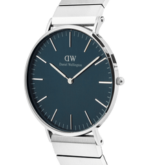 Classic Piano Link Arctic Silver watch with a brushed arctic blue dial, minimalist markers, and a polished silver piano link strap shown from a side angle.