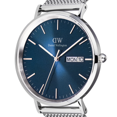 Close-up of the Daniel Wellington Classic Day Display Sterling Arctic watch, highlighting the textured blue dial, silver hour markers, and day-date window within a polished stainless steel case.