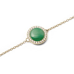 Close-up of Audrey Bracelet Jade Gold featuring a domed green jade centre and sparkling cubic zirconia halo on a gold chain.