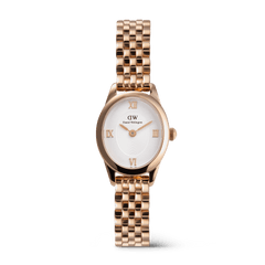 Rose gold women’s watch with an oval case, white sunray dial, raised Roman numerals, and a polished beans link bracelet, designed for a refined and elegant look.