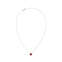 Delicate silver necklace with a domed red agate pendant and white cubic zirconia accents on a fine adjustable chain.