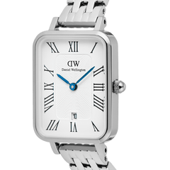 Close-up of the Quadro Roman Numerals Date 5-link Silver watch, highlighting the rectangular white dial with black Roman numerals, blue hands, guilloché detailing, and a date window above six o’clock, paired with a polished silver five-link bracelet.