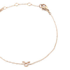 Slim rose gold chain bracelet with an adjustable clasp, featuring a sparkling crystal-set Taurus zodiac pendant as the centrepiece.