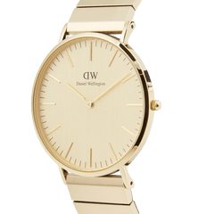 Classic Piano Link Gold Unitone watch featuring a brushed gold dial, minimalist face, and geometric piano link bracelet in a side profile view.
