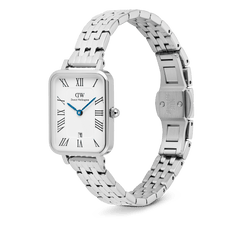 Quadro Roman Numerals Date 5-link Silver watch featuring a rectangular white dial with Roman numerals, blue hands, a date window at six o’clock, and a polished five-link stainless steel bracelet with a butterfly clasp.