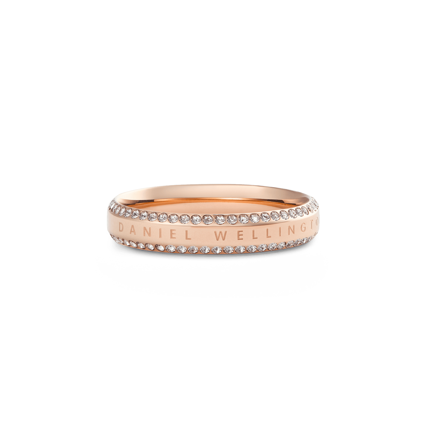 Rose gold Daniel Wellington ring with a polished band, featuring two rows of white cubic zirconia crystals along the edges and an engraved signature for a refined, modern look.