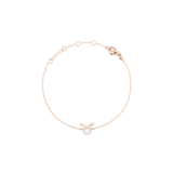 Rose gold chain bracelet featuring a delicate Taurus zodiac pendant adorned with hand-set crystals and an adjustable clasp.