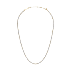Gold tennis necklace featuring a continuous row of sparkling crystals set in a slim, adjustable chain with three sizing rings, designed for a refined and elegant look.