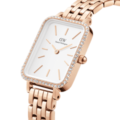 Close-up of the Quadro Lumine Bezel 5-Link Melrose women’s watch, featuring a rectangular white dial, rose gold case with a sparkling stone-set bezel, and a polished 5-link bracelet.