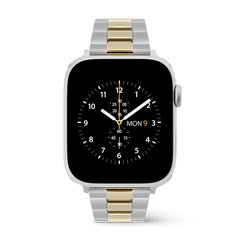 Apple Watch with the Daniel Wellington Smartwatch Iconic Link two-tone strap, showcasing a classic three-link bracelet in brushed silver stainless steel and polished gold centre links for a refined, modern finish.
