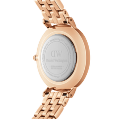 Back view of the Petite Lumine Bezel 5-Link Melrose watch, showing the engraved Daniel Wellington caseback and rose gold stainless steel bracelet.