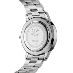 Back view of the Steven Harrington x Daniel Wellington Iconic Link Multicolor watch, showing the engraved limited edition caseback, brushed stainless steel strap, and unique serial number.