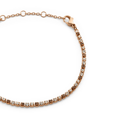 Close-up of the Classic Tennis Bracelet Honey Combo Rose Gold, highlighting its rose gold chain and individually set honey-toned Preciosa crystals with a secure lobster clasp.