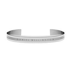 Minimalist Daniel Wellington Elan Bracelet in polished silver stainless steel, featuring a curved open cuff design with a brushed centre and engraved branding.