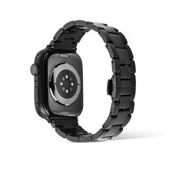 Rear view of an Apple Watch fitted with the Smartwatch Iconic Link Onyx strap, highlighting the black PVD-plated stainless steel links and butterfly clasp for a sleek, contemporary finish.