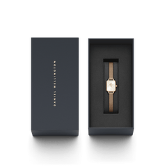 Quadro Mini Melrose Champagne women’s watch with a rectangular champagne dial and rose gold mesh strap, elegantly presented in a black Daniel Wellington gift box.