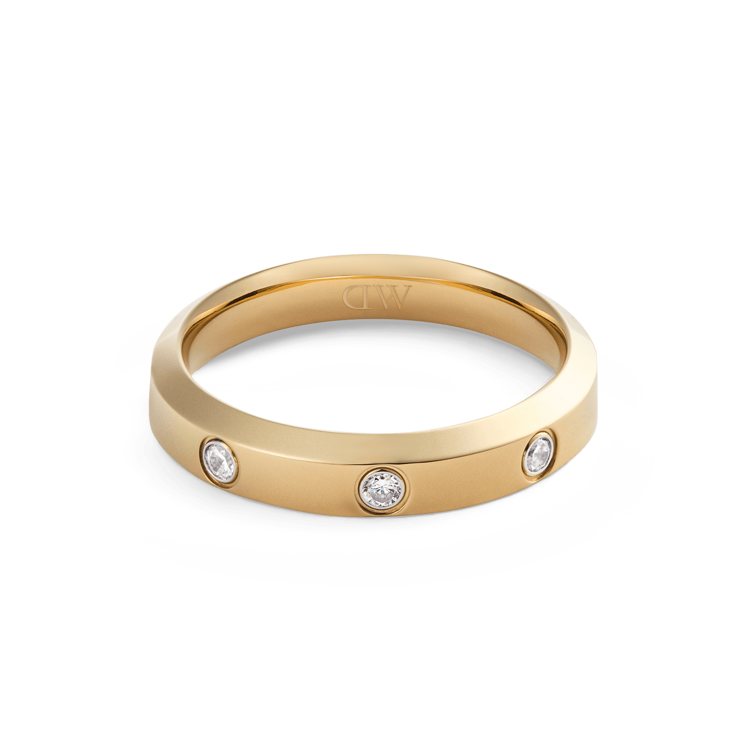 Classic Lumine Ring Gold 4 mm with a sleek gold band, set with three sparkling cubic zirconia stones and finished in polished PVD gold plating for a minimalist, elegant look.