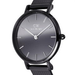 Close-up of the Petite Reflection Black watch by Daniel Wellington, highlighting the real mirror glass dial, minimalist silver markers, and polished black stainless steel case.