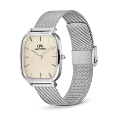 Daniel Wellington Marlon Sterling Linen watch with a cushion-shaped stainless steel case, linen-textured beige dial, minimalist silver hour markers, and an adjustable silver mesh strap with clasp.