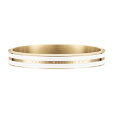 Satin white and gold Emalie Infinite bangle with a sleek enamel inlay and engraved Daniel Wellington logo, offering a refined and modern look.