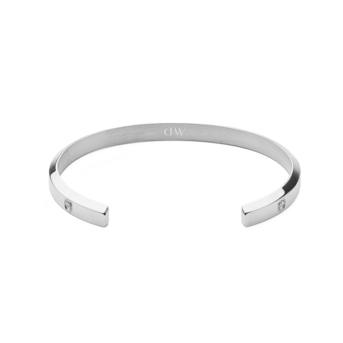 Classic Lumine Bracelet Silver 5.5mm shown from above, highlighting its open cuff design in polished stainless steel with subtle cubic zirconia crystal accents and a discreet interior engraving.