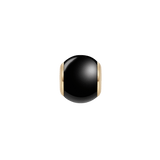 Polished black ceramic orb charm with gold PVD-plated stainless steel accents, designed for necklaces or bracelets and featuring a smooth, contemporary finish.