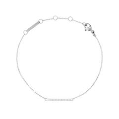 Slim silver bracelet featuring a delicate chain and a curved bar set with sparkling white cubic zirconia crystals, finished with an adjustable clasp for a refined, minimalist look.