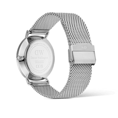 Rear view of the Classic Day Display Sterling Champagne watch, showing the engraved stainless steel case back and adjustable silver mesh strap with a secure clasp.