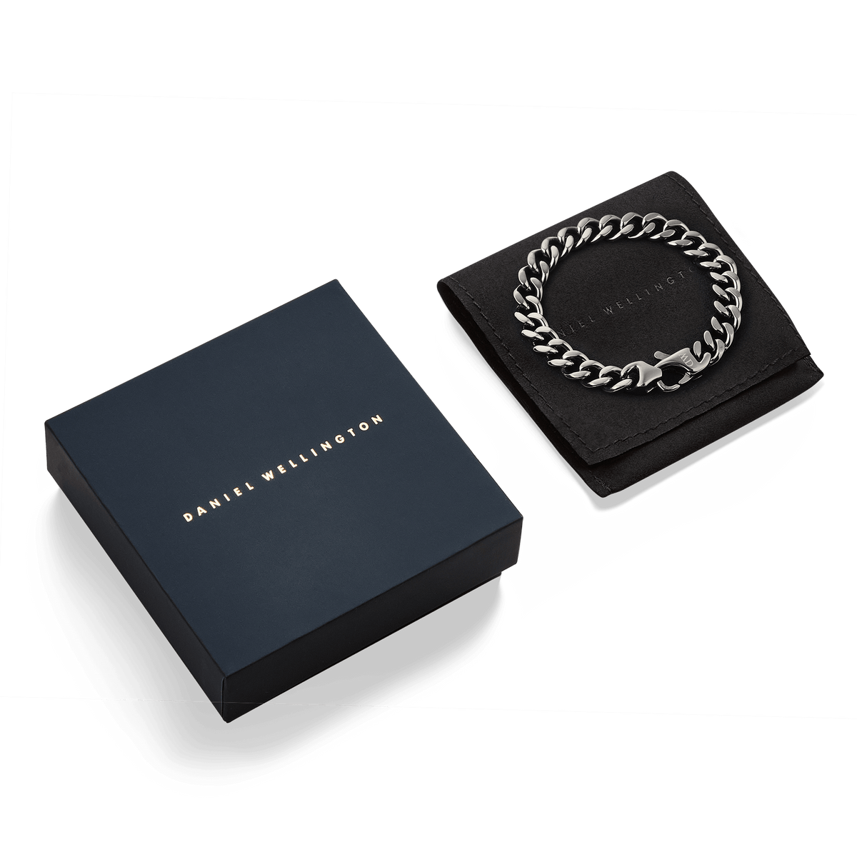 Ellipse Cuban Chain Bracelet Graphite displayed on a black pouch next to a navy Daniel Wellington gift box, highlighting its polished links and elegant presentation packaging.