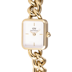 Close-up of Jolie Chain Gold women’s watch with gold chain bracelet and minimalist white square dial, elegant modern design.