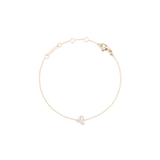 Slim gold chain bracelet with an adjustable clasp, featuring a crystal-encrusted zodiac pendant in a minimalist design.
