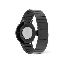 Rear view of the Classic Piano Link Onyx Unitone watch showing the brushed black stainless steel piano link strap, engraved case back, and butterfly clasp.